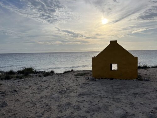 Sunsetting behind structure